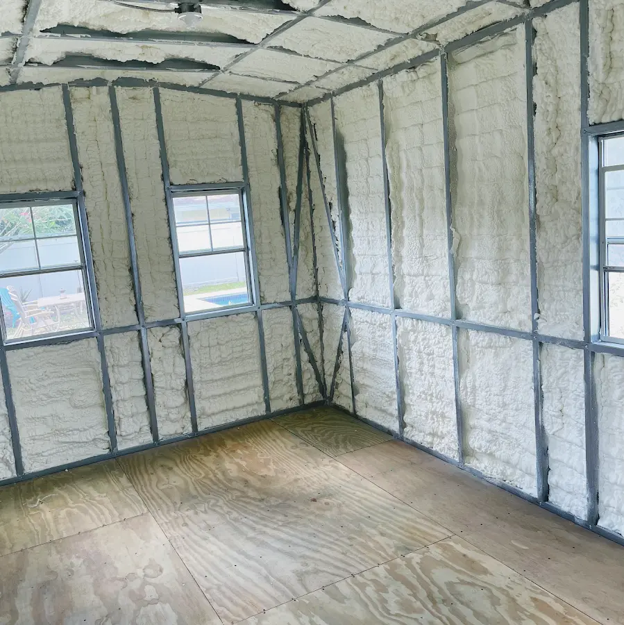 Closed-cell spray foam insulation applied to wall cavities in a residential project in Lanett